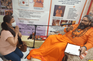 Counselling session with a saffron-robed spiritual guide