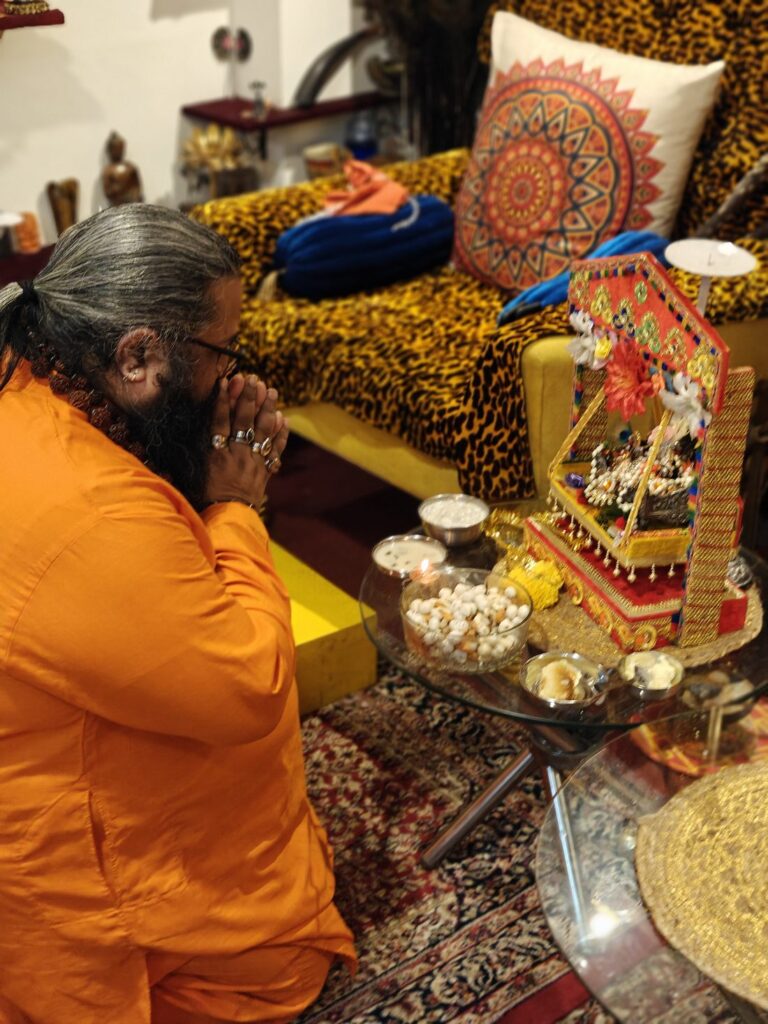 Tantrguru Shree Ganesh Dubey prays before Laddu Gopal in a decorated jhula with bhog of makhana and sweets on Janmashtami