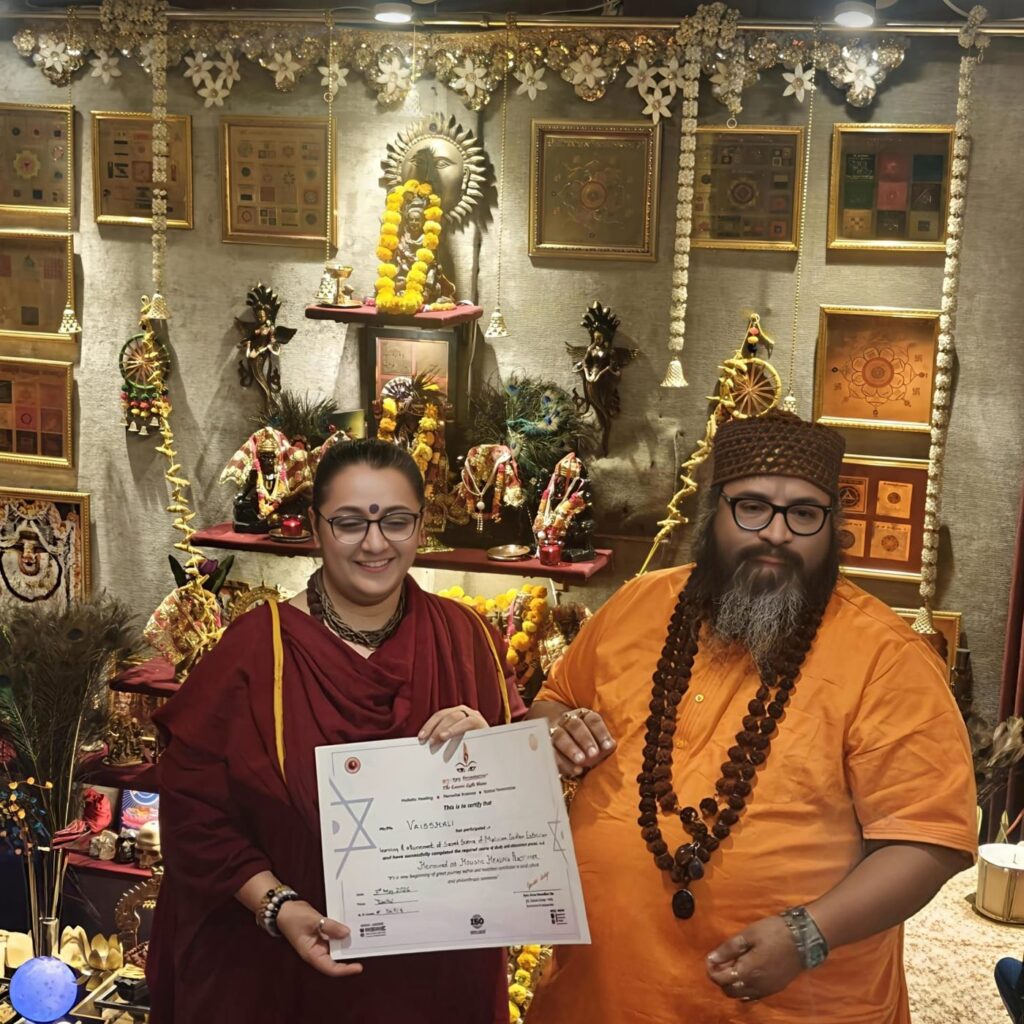 Tantrguru Shree Ganesh Dubey awards a Holistic Healing Practitioner certificate to a tantra student at the Agnitra Foundation ceremony in Delhi, May 2026