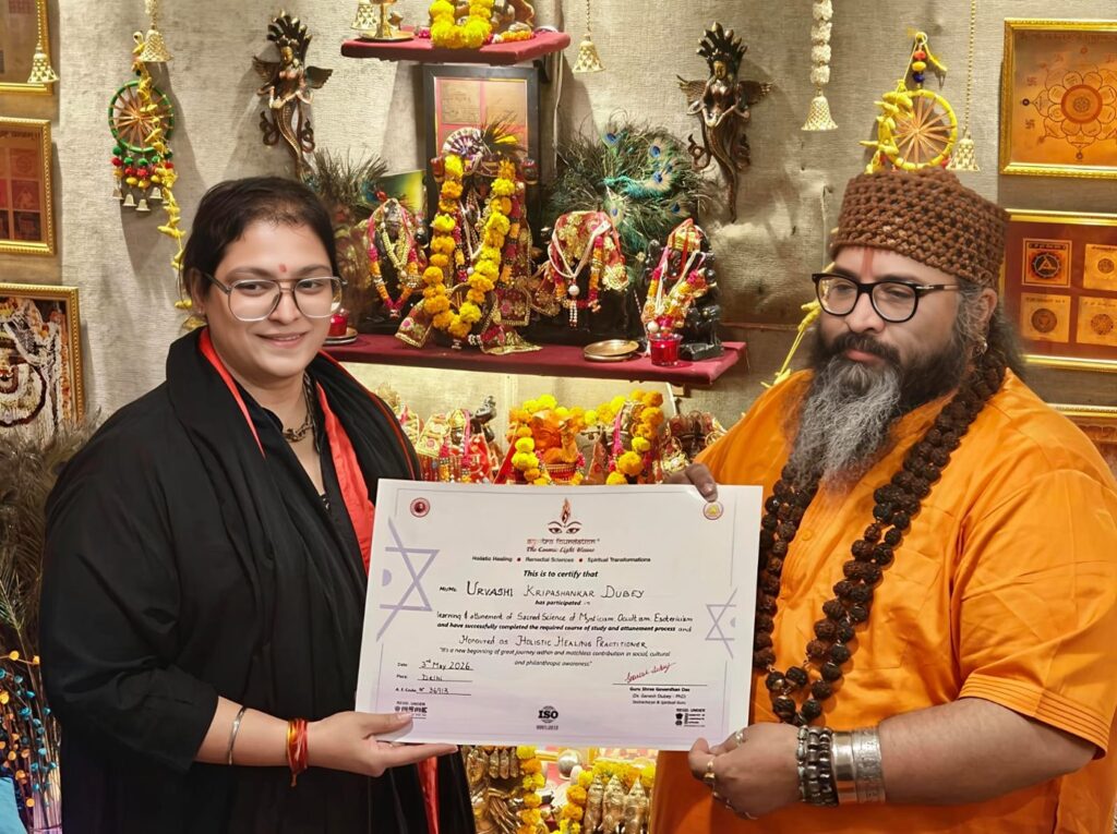 Tantrguru Shree Ganesh Dubey awards a Holistic Healing Practitioner certificate to a tantra student at the Agnitra Foundation ceremony in Delhi, May 2026
