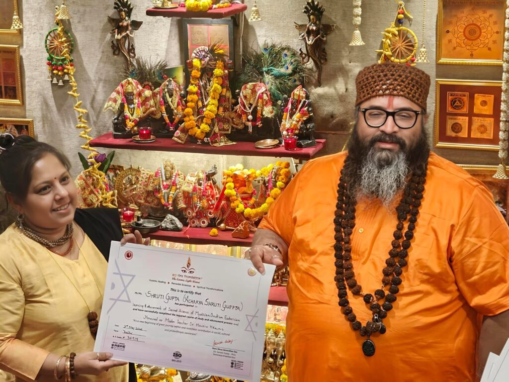 Tantrguru Shree Ganesh Dubey awards a Master Teacher of Holistic Healing certificate to a tantra student at the Agnitra Foundation ceremony in Delhi, May 2026