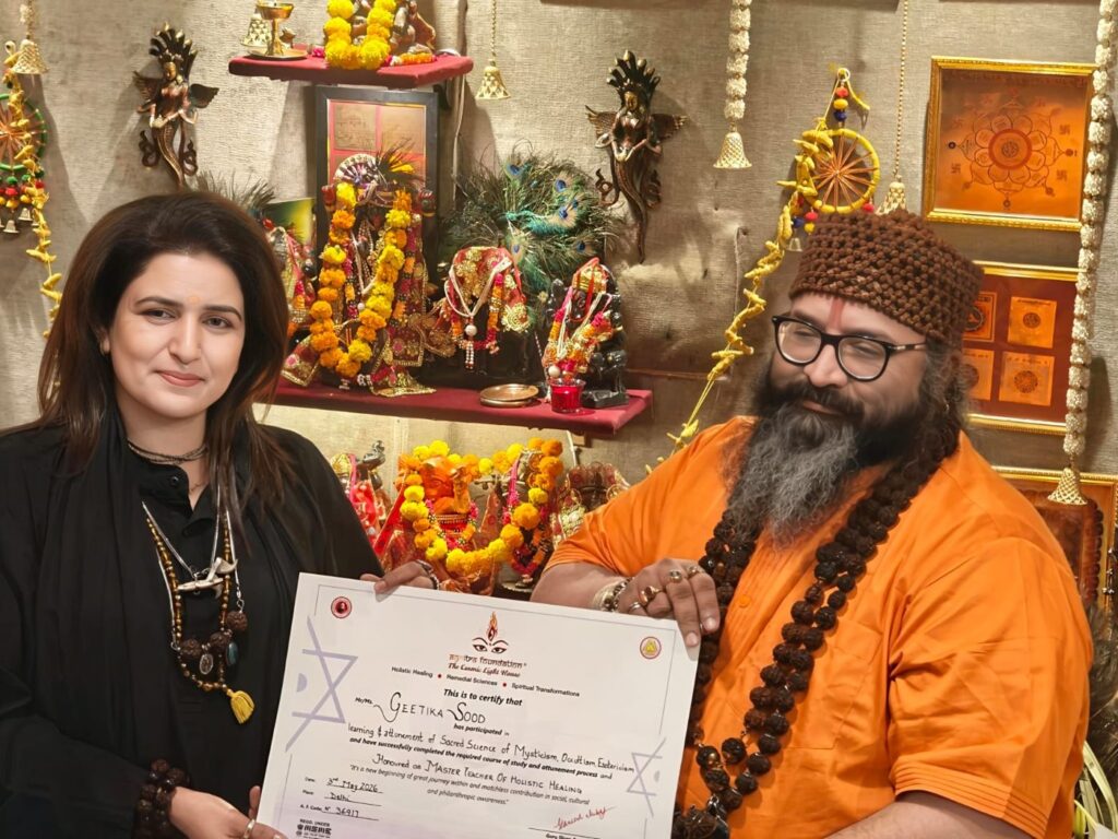 Tantrguru Shree Ganesh Dubey awards a Master Teacher of Holistic Healing certificate to a tantra student at the Agnitra Foundation ceremony in Delhi, May 2026